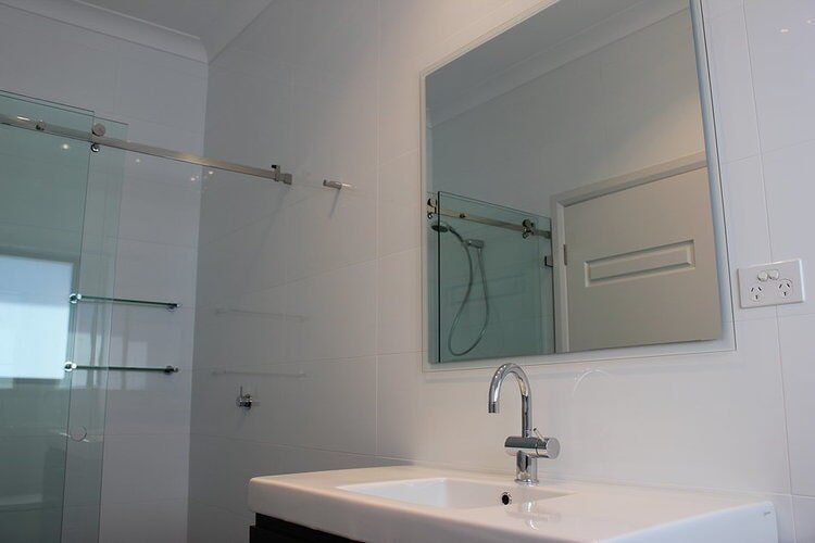 Bathroom Vanity & Mirror — Builders  in Fernhill, NSW