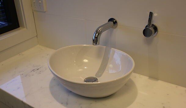 Floating White Bathroom Sink — Builders  in Fernhill, NSW