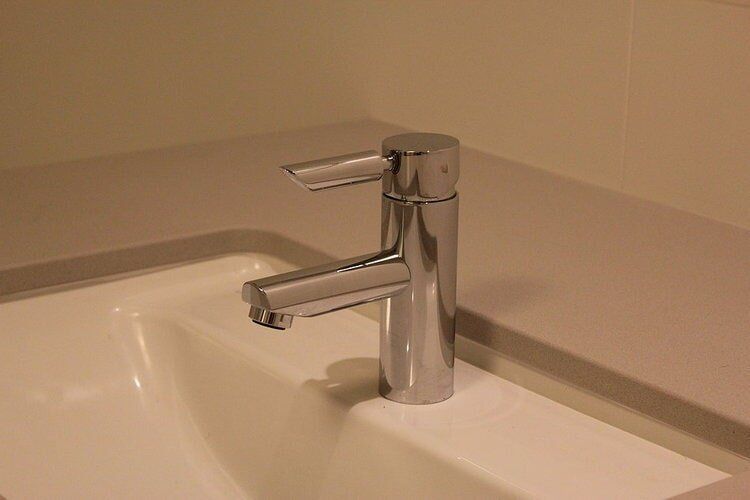 Stainless Tap in Bathroom — Builders  in Fernhill, NSW