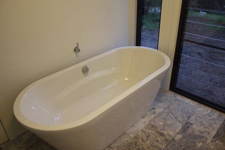 White Freestanding Bath — Builders  in Fernhill, NSW