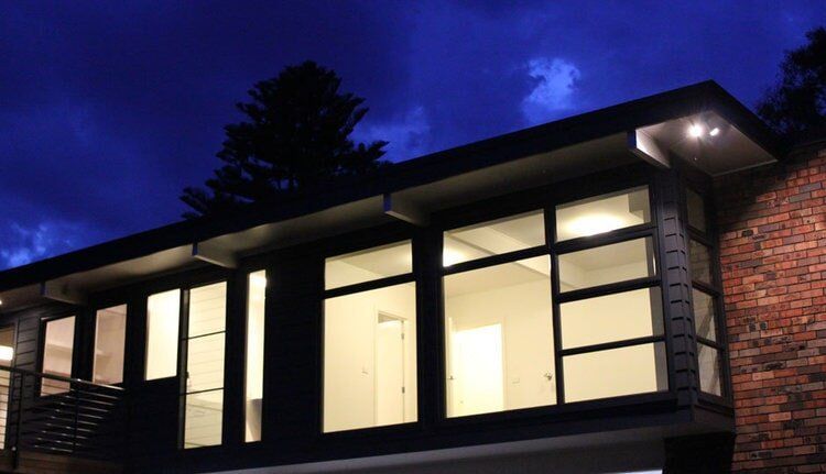 House Exterior at Night — Builders  in Fernhill, NSW