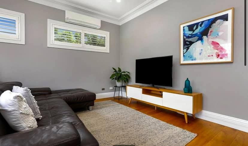 A Living Room With a Couch — Craig Allman Construction Pty Ltd In Fernhill, NSW