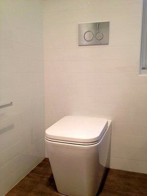 Modern White Toilet — Builders  in Fernhill, NSW