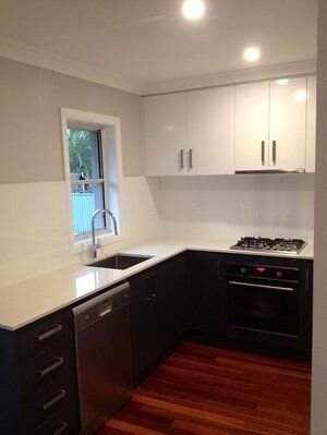 New Glossy Kitchen — Builders  in Fernhill, NSW