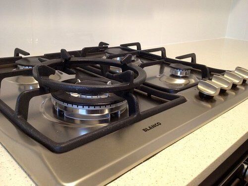 Stainless Gas Stove Top — Builders  in Fernhill, NSW