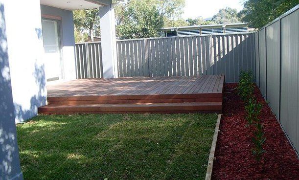 Backyard With Deck — Builders  in Fernhill, NSW