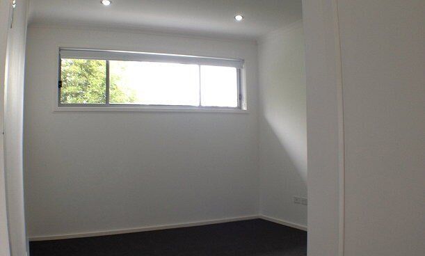 Empty Room With White Walls — Builders  in Fernhill, NSW