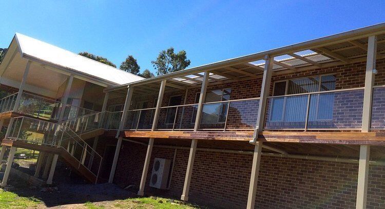Balcony with Glass Railings — Builders  in Fernhill, NSW