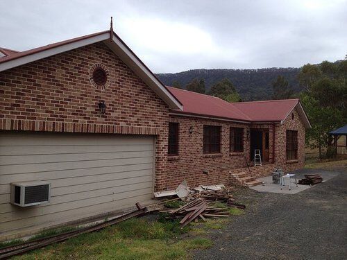 House With White Garage — Builders  in Fernhill, NSW