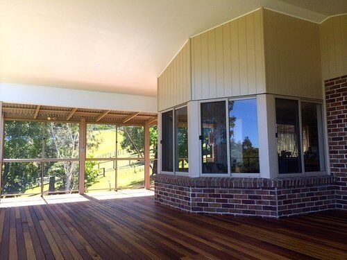 Alfresco Area With Wooden Flooring — Builders  in Fernhill, NSW