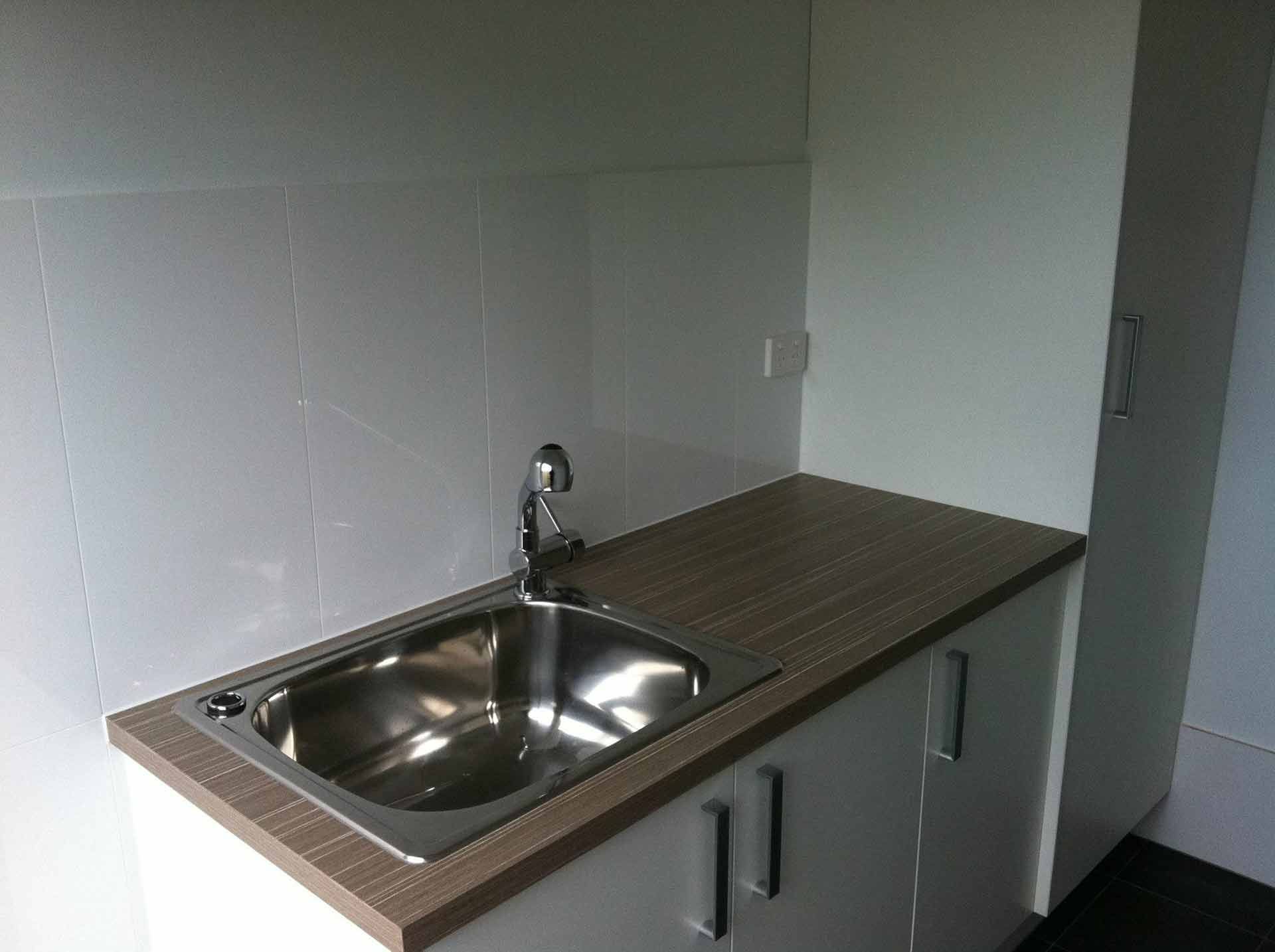 A Stainless Steel Sink is Sitting on Top — Craig Allman Construction Pty Ltd In Wollongong, NSW