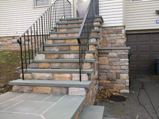 Brick and Stone stair walkway to entrance door - front yard landscaping services - Stellato Bros. Inc. in Feeding Hills, MA