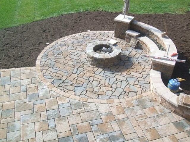 Stone and brick patio with built in fireplace - front yard landscaping services - Stellato Bros. Inc. in Feeding Hills, MA