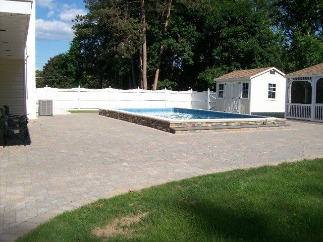 Back yard brick walkway - back yard landscaping services - Stellato Bros. Inc. in Feeding Hills, MA