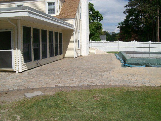 Back yard brick walkway - back yard landscaping services - Stellato Bros. Inc. in Feeding Hills, MA