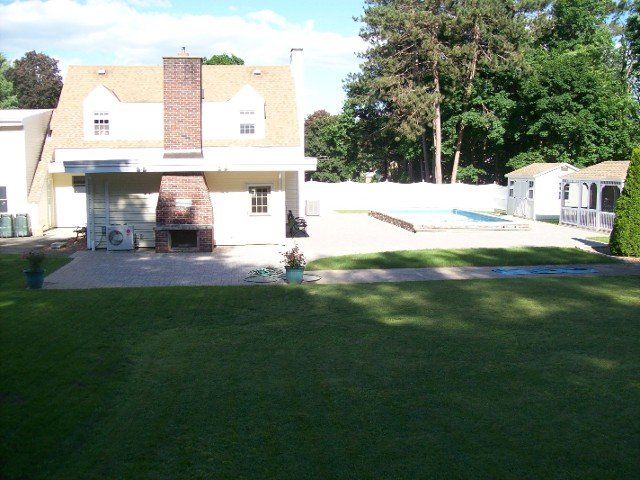 Back yard brick walkway - back yard landscaping services - Stellato Bros. Inc. in Feeding Hills, MA