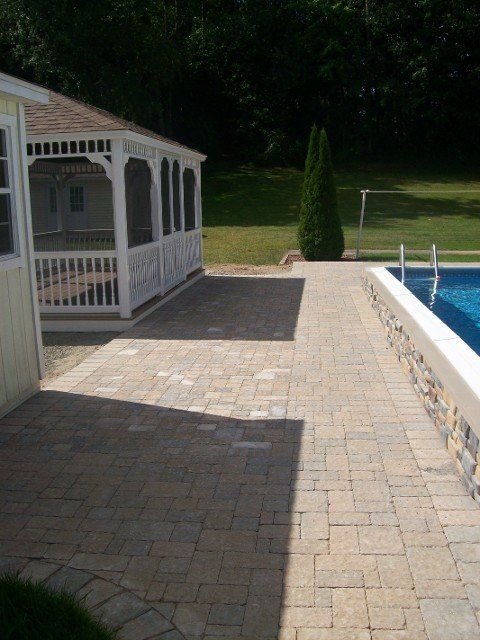 Back yard brick walkway - back yard landscaping services - Stellato Bros. Inc. in Feeding Hills, MA