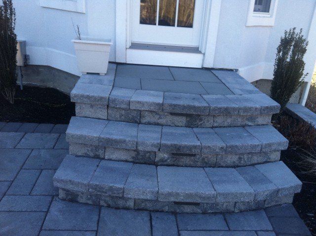 Brick and stone stairs to doorway entrance - brick pavers, walkways and patios landscaping services - Stellato Bros. Inc. in Feeding Hills, MA