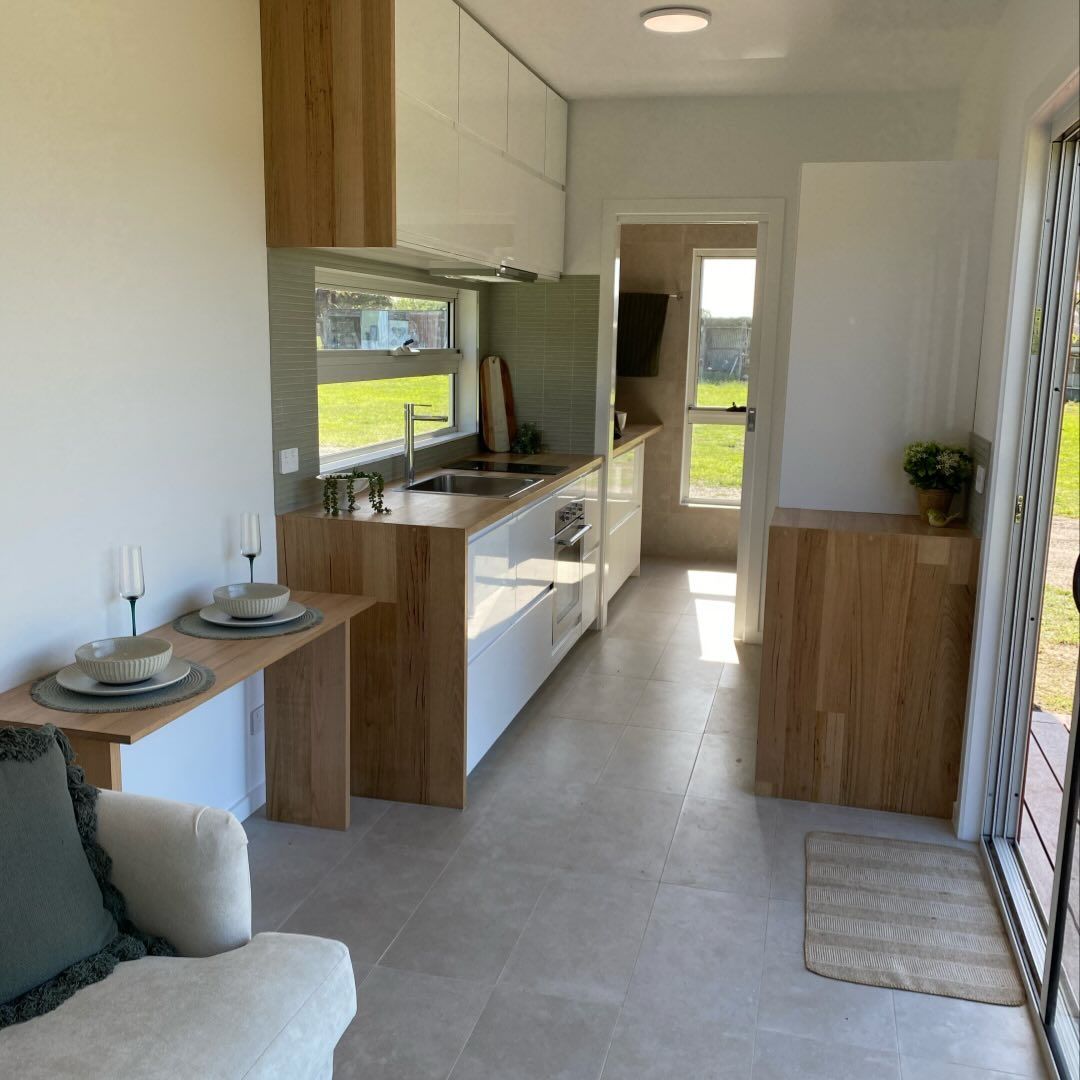 Living Room With A Couch And A Kitchen — GTH Living In Geelong, VIC