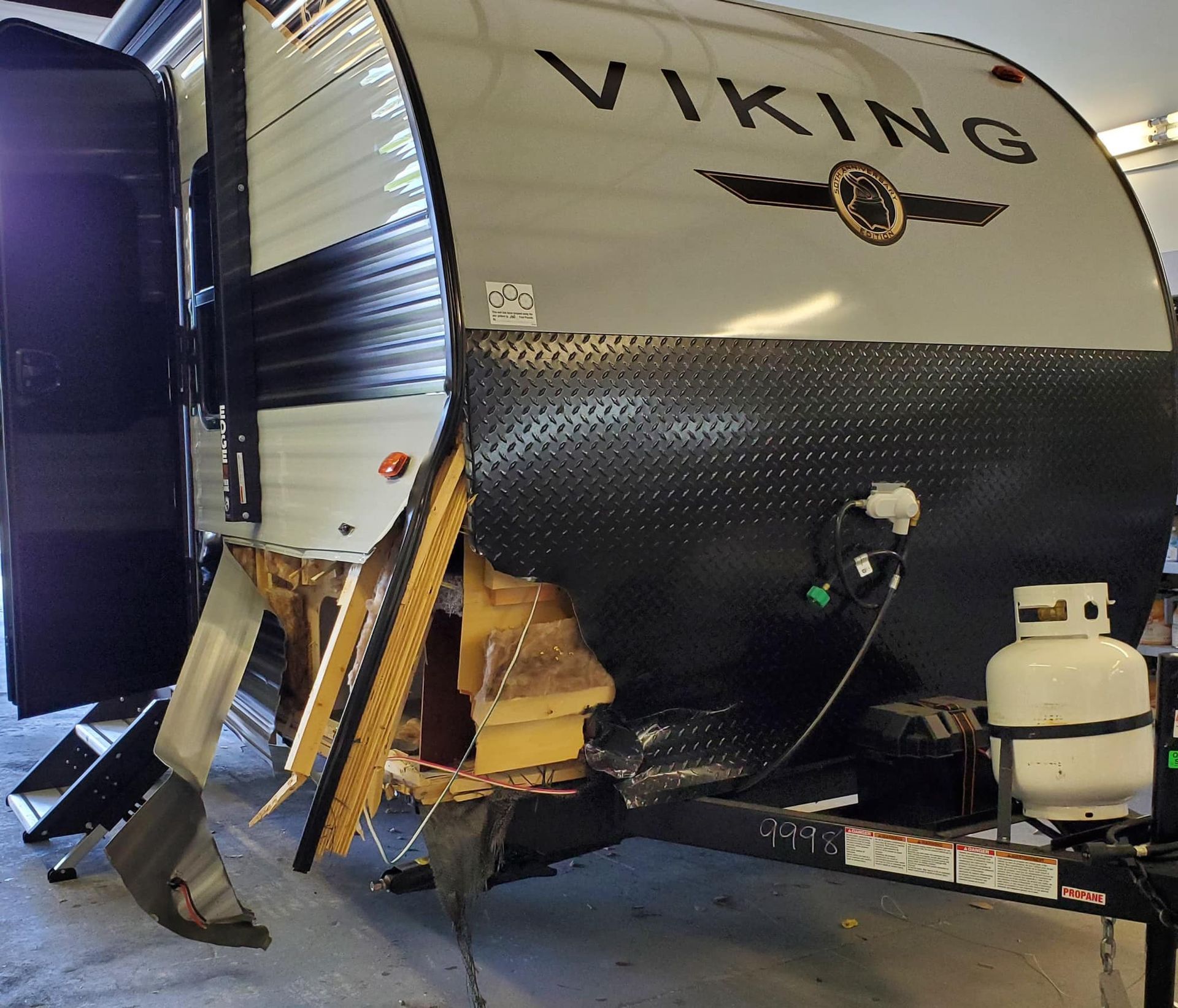 A viking trailer is parked in a garage