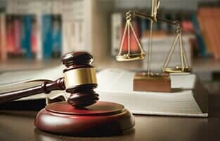 Gavel and Scales of Justice in a Table — Attorney in Lawrenceburg, IN