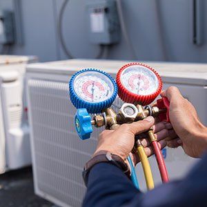 Heat Pump System Installation Ashland, OR — Worker Checking Temperature In Ashland, OR