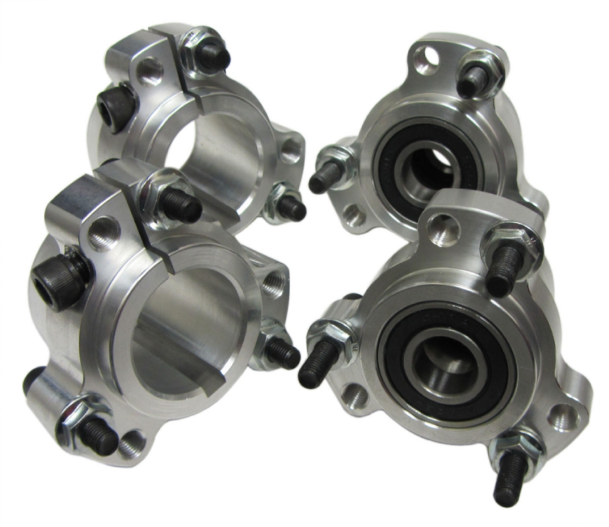 Four pieces of metal with bearings on them on a white background