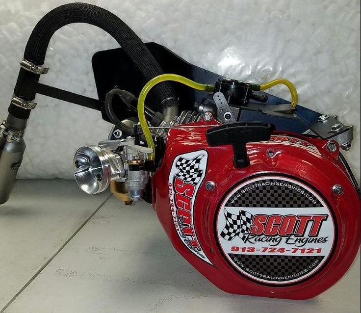 A red scott engine sits on a white surface