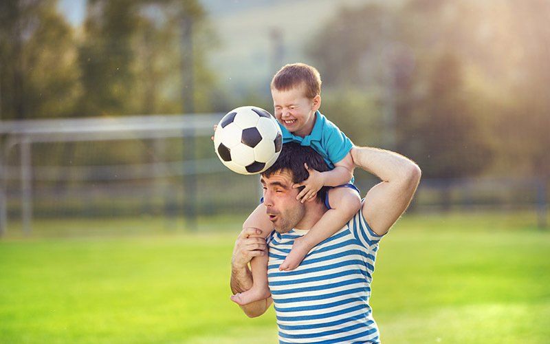 Father and Son Playing Soccer — Jacksonville, FL — Willman Air