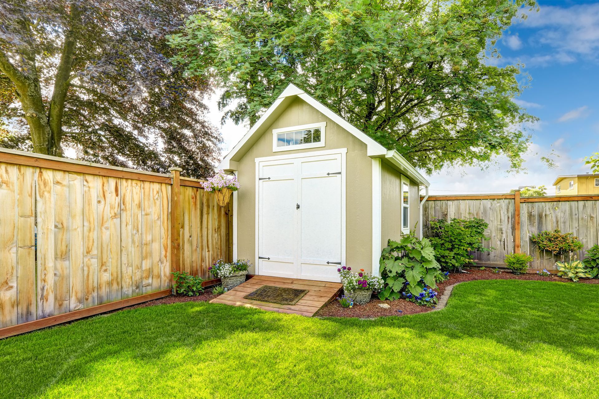 Beige backyard shed.