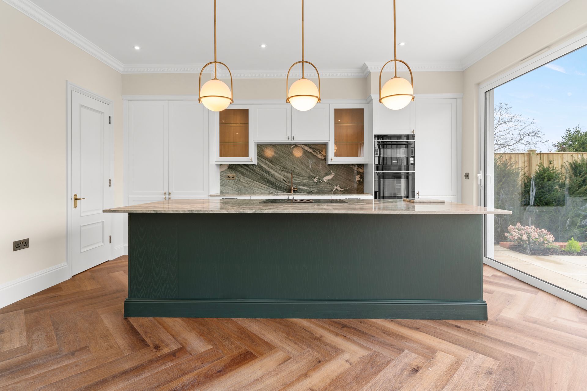 There is a large island in the middle of the kitchen.