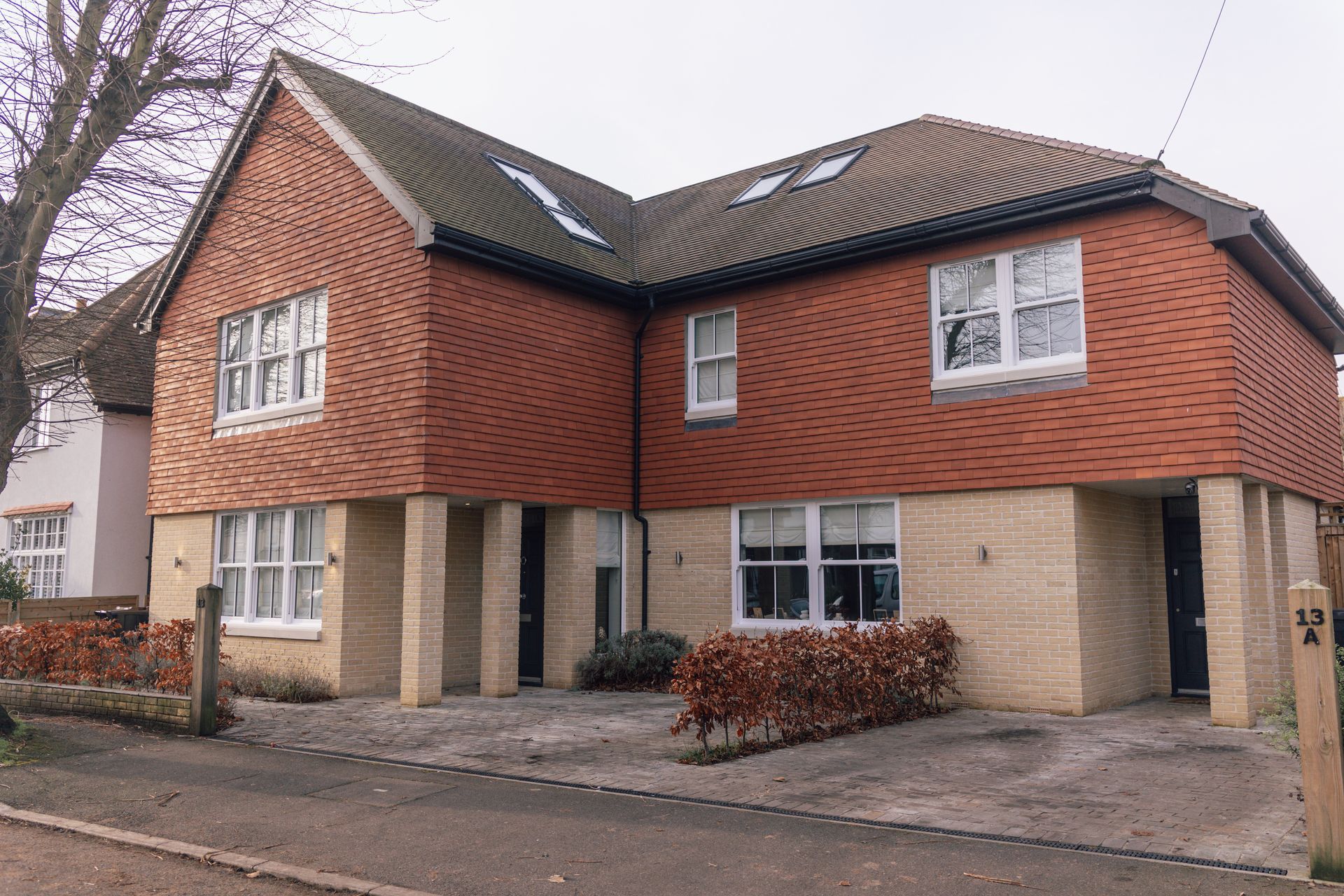 A large red brick house with a lot of windows