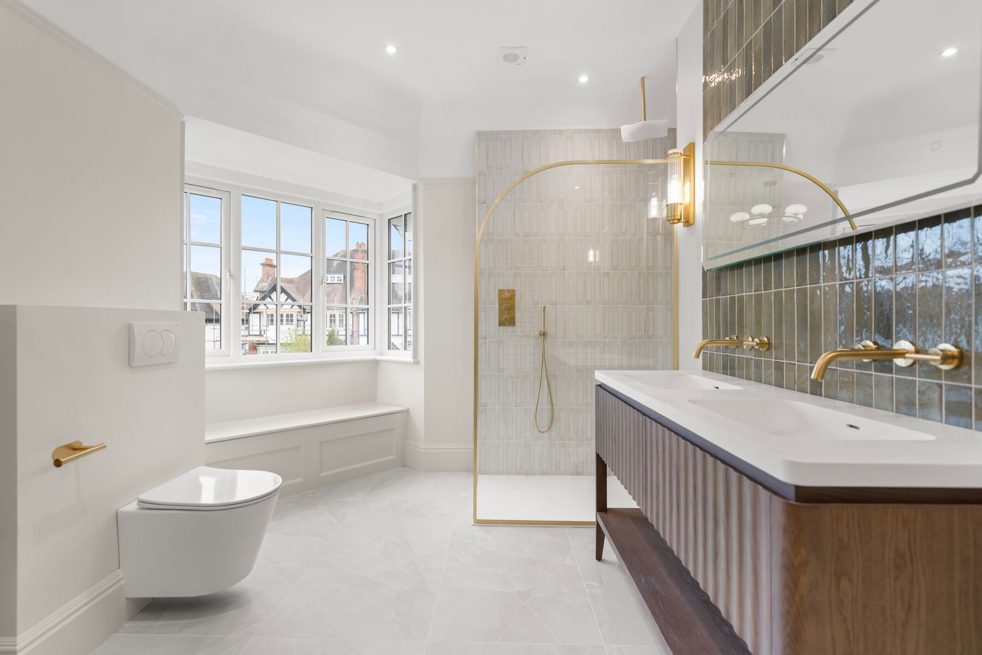 A bathroom with a toilet , sink , and walk in shower.