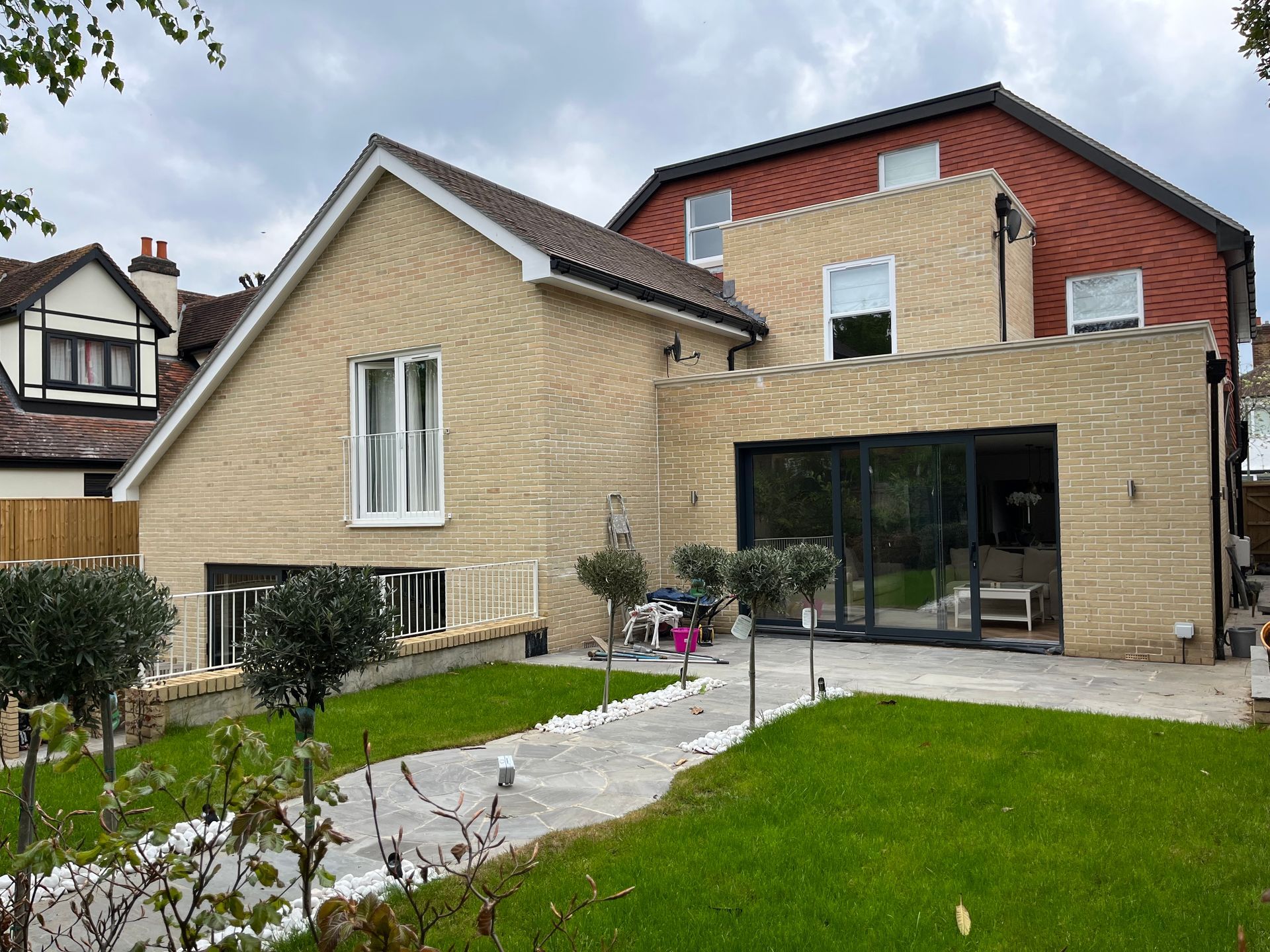 A large house with a large lawn in front of it.