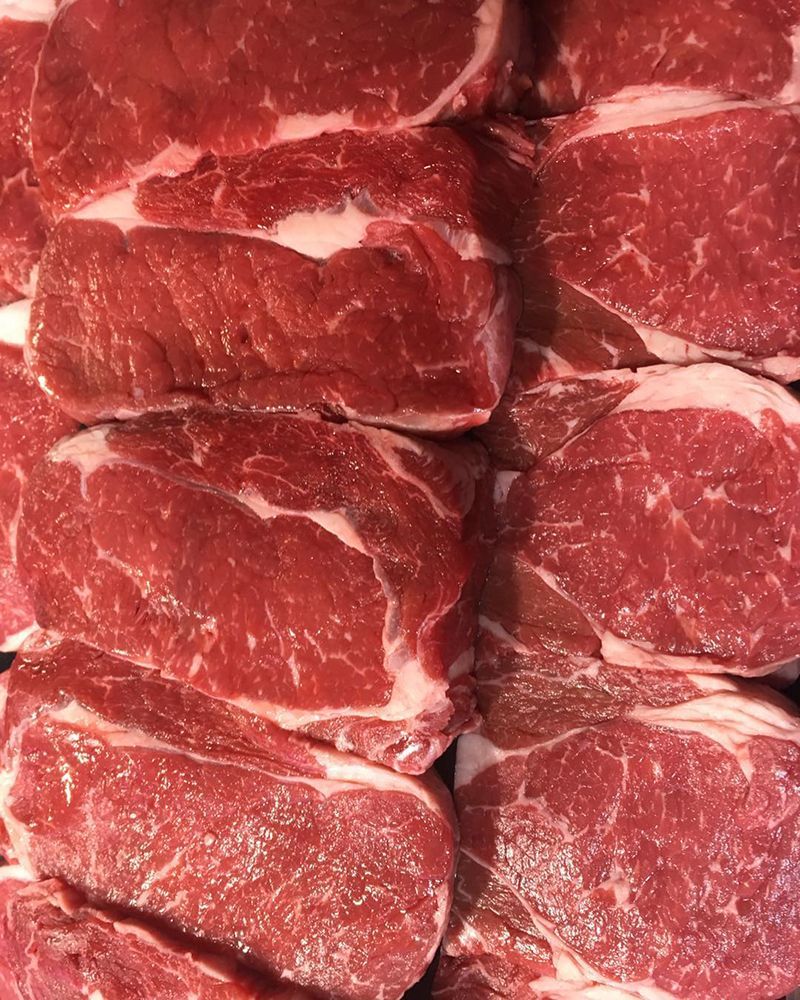 A Close Up of a Pile of Raw Steaks on a Table — Nambour Heights Butchery in Nambour, QLD