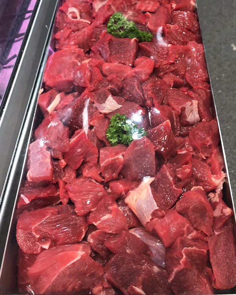 A Tray of Chopped Beef With Parsley on Top — Nambour Heights Butchery in Nambour, QLD