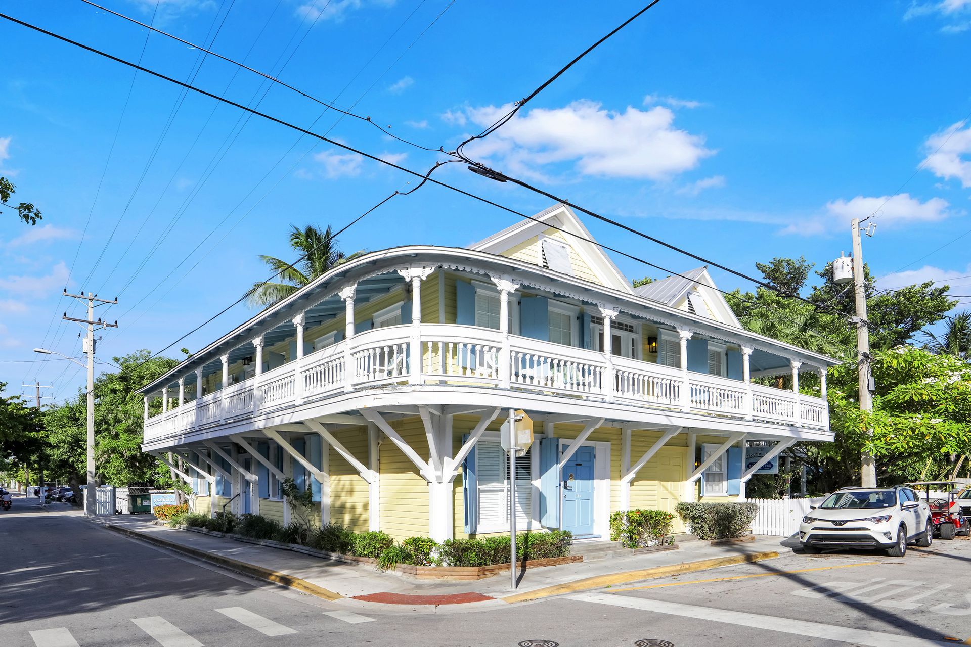 Yellow and white building with wraparound balcony in Key West, Florida.