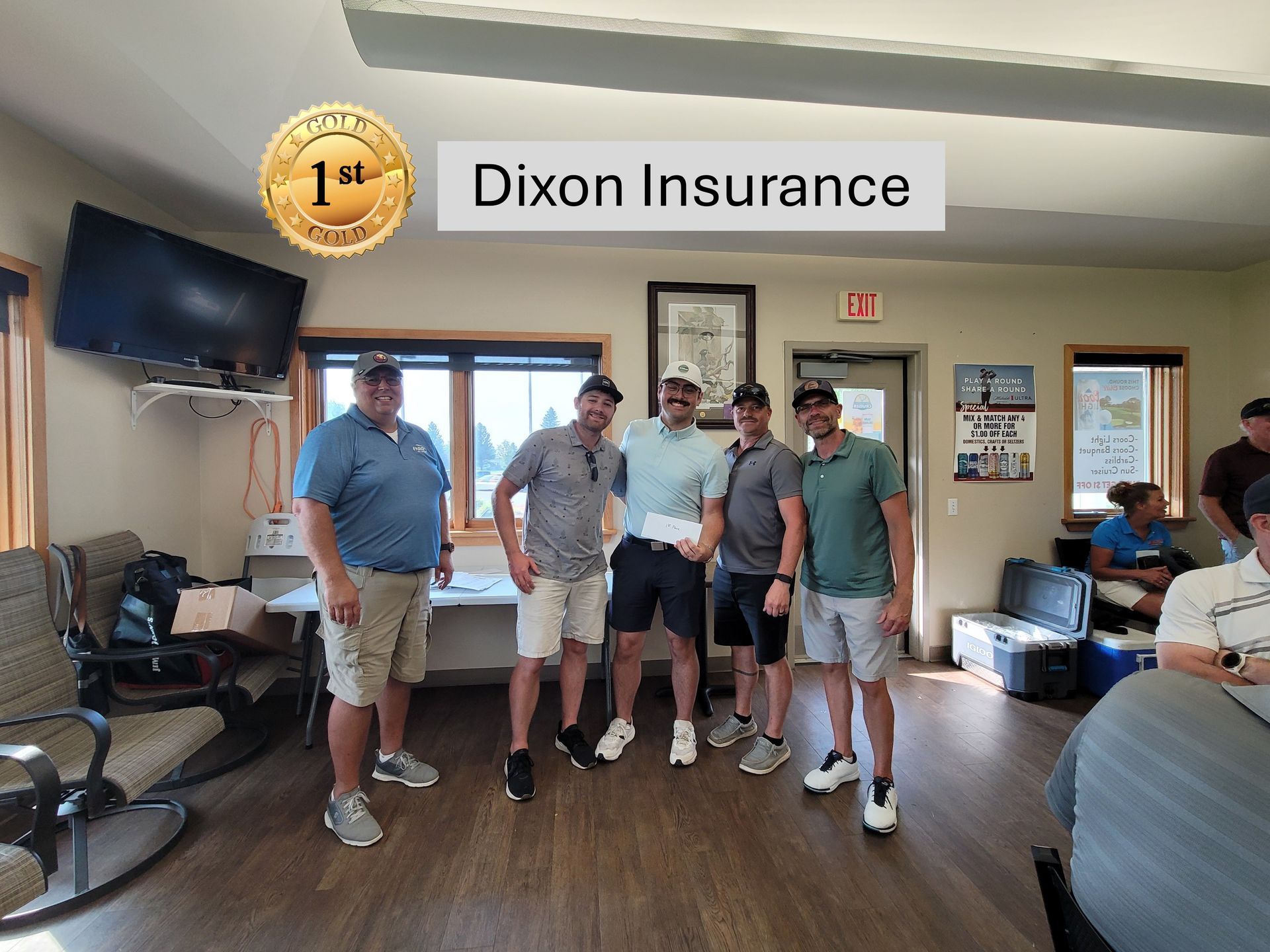 Group of men inside, holding a check, celebrating a golf tournament win, 