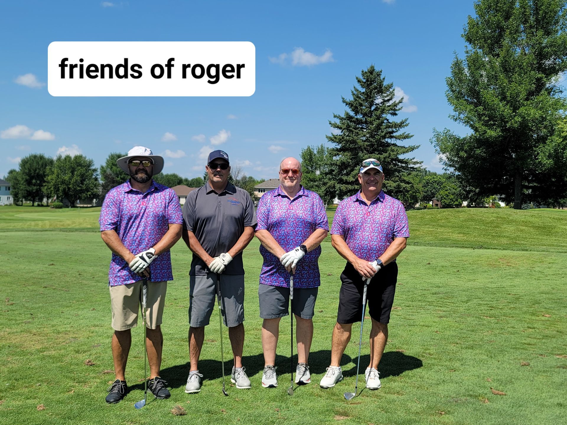 Four men in golf attire on a green. Text overlay: 