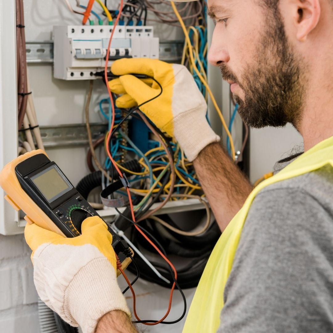 contractor using volt meter