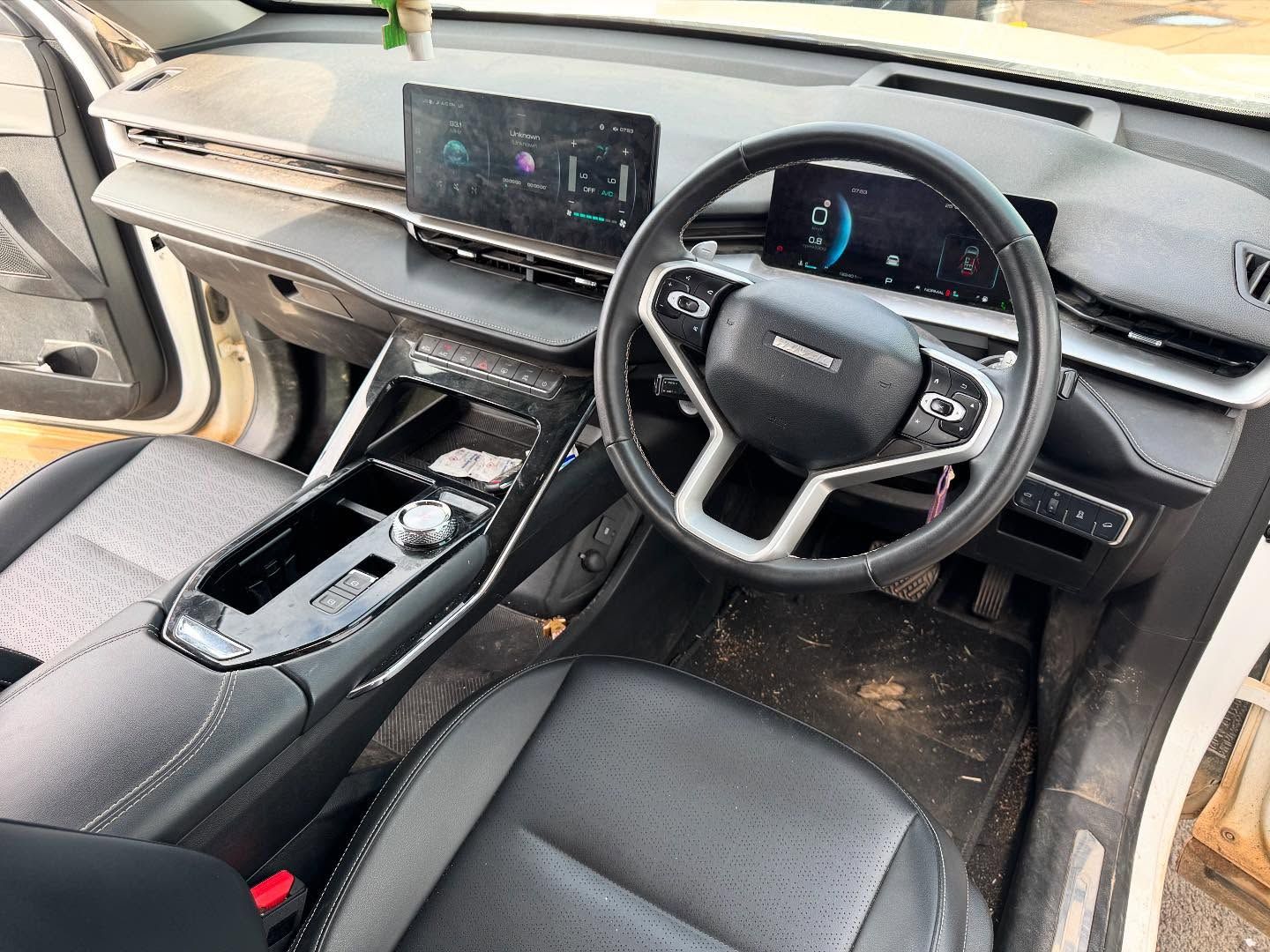 Car Interior: Black Leather Seats, Dashboard With Infotainment Screen — Oliver's Hand Car Wash in Norville, QLD