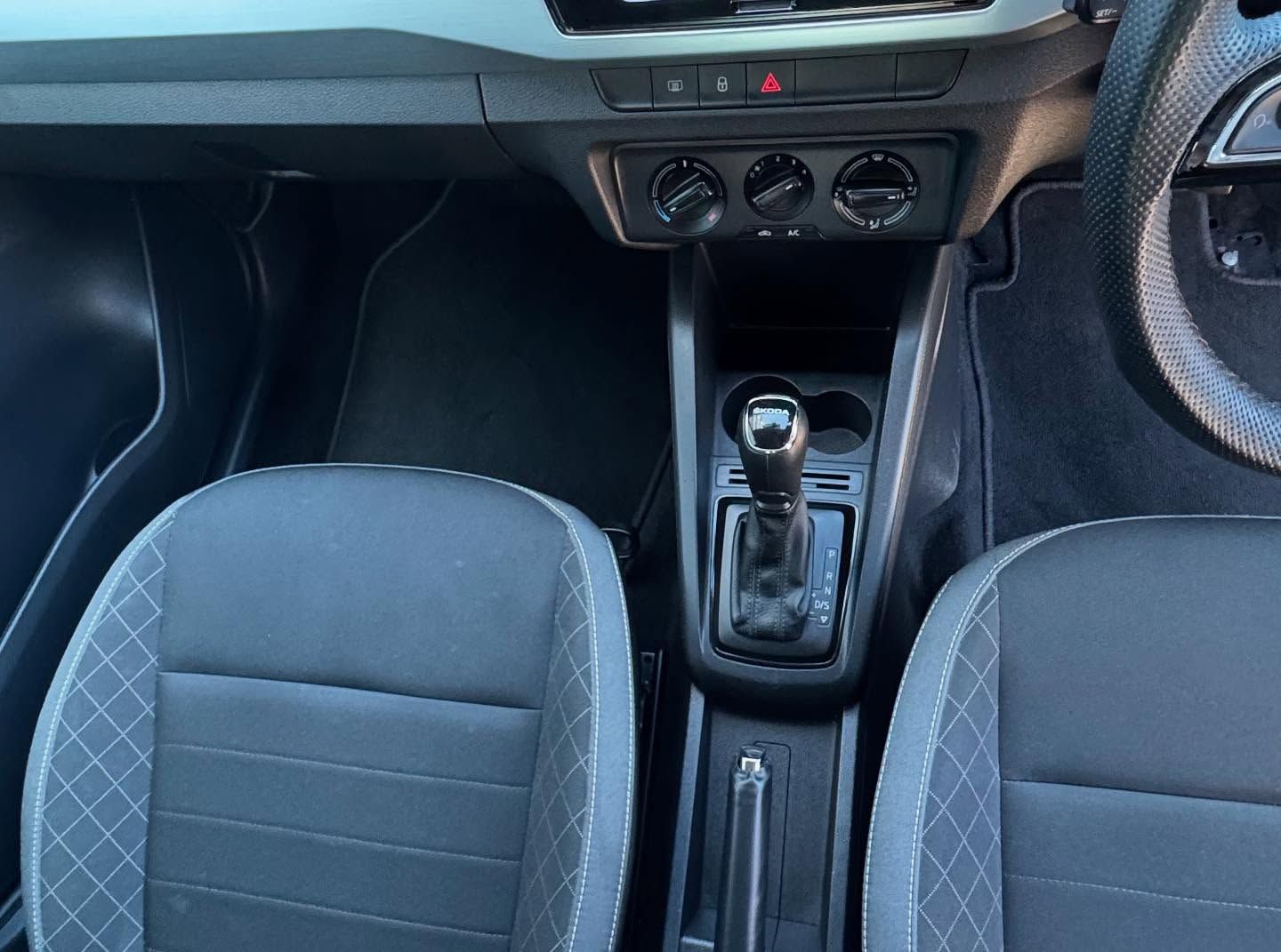 Car Interior With Black Seats, Gear Shift, Dashboard, and Floor Mats — Oliver's Hand Car Wash in Norville, QLD