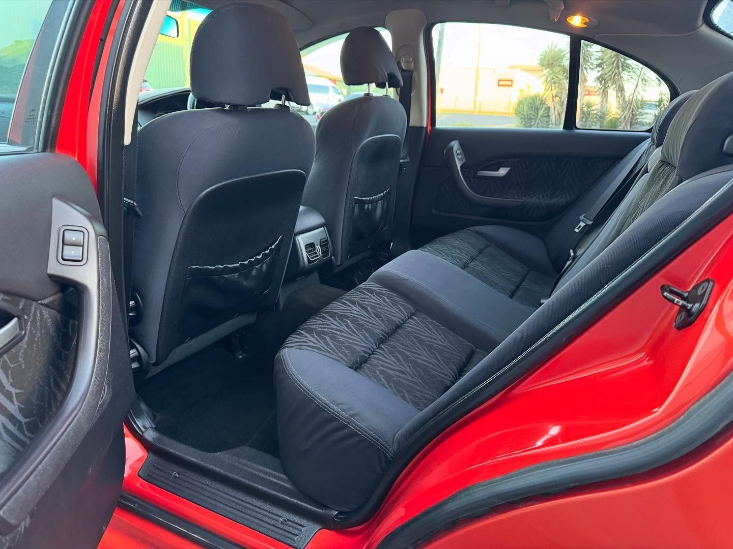 Red Car Interior With Black Cloth Seats and Headrests — Oliver's Hand Car Wash in Norville, QLD