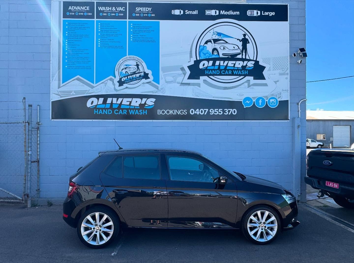 Black Car Parked Outside — Oliver's Hand Car Wash in Norville, QLD
