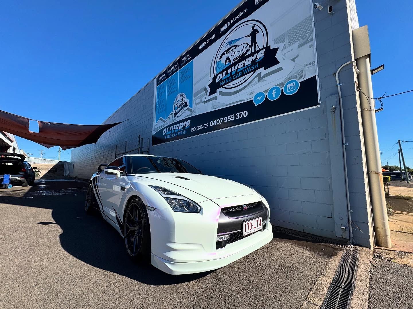 White Nissan GT-R Sports Car Parked Outside — Oliver's Hand Car Wash in Norville, QLD