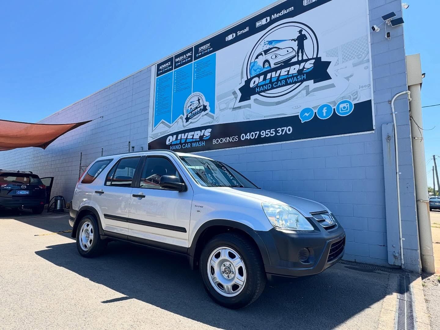 Silver Honda Cr-v Parked in Front of a Car Wash Business — Oliver's Hand Car Wash in Norville, QLD