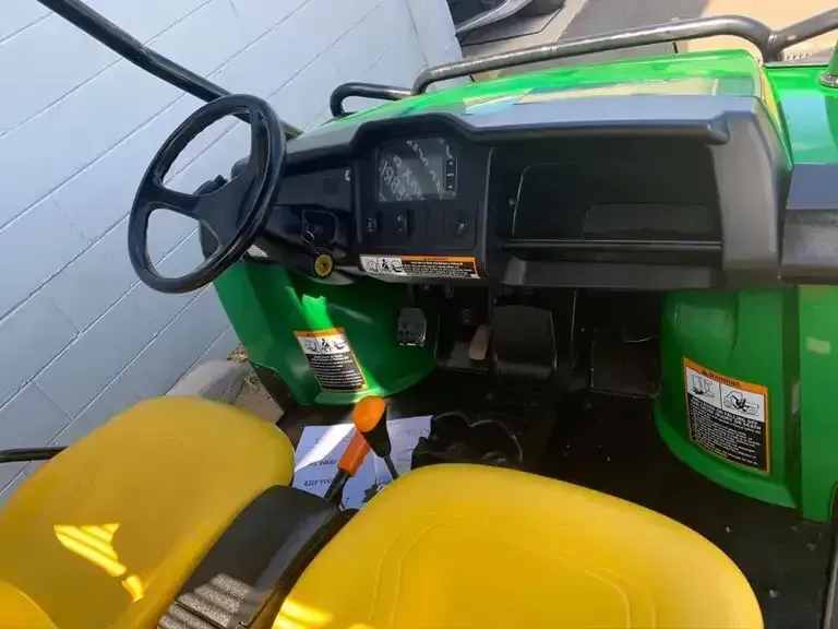 Interior View of a Green and Yellow Utility Vehicle — Oliver's Hand Car Wash in Norville, QLD