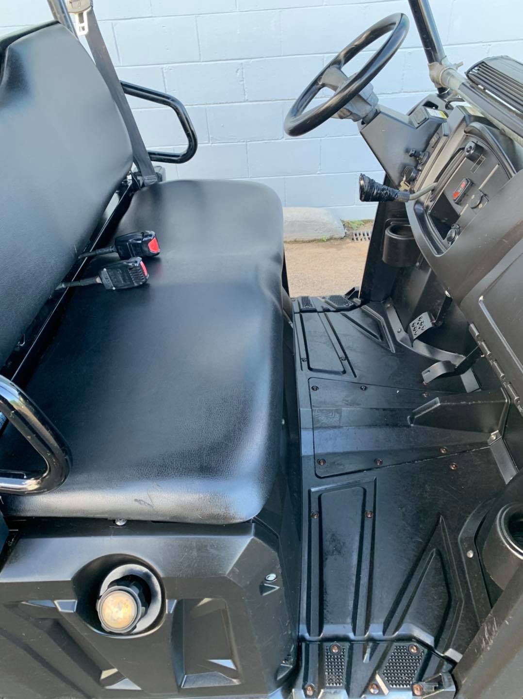 Black Utility Vehicle Interior, Featuring Steering Wheel — Oliver's Hand Car Wash in Norville, QLD