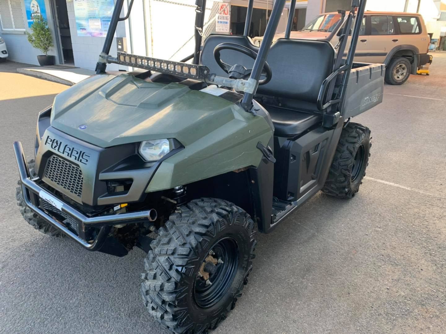 Olive Green Polaris Ranger Utv With Black Roll Cage and Large Tires Parked Outside — Oliver's Hand Car Wash in Norville, QLD
