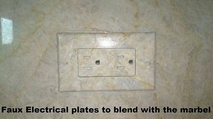 A picture of a faux electrical plates to blend with the marble